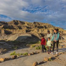 Family hiking in Montana at sunset